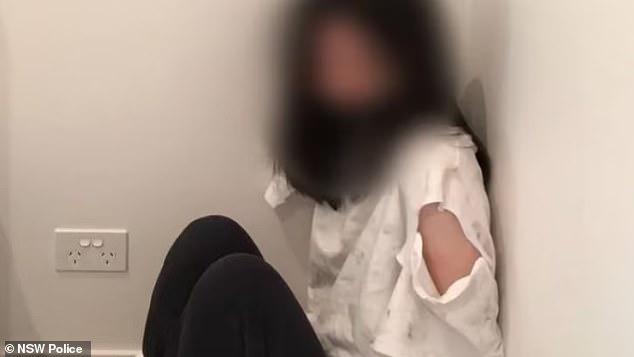 Another woman is pictured on the ground with torn clothing, hugging her knees to her chest.