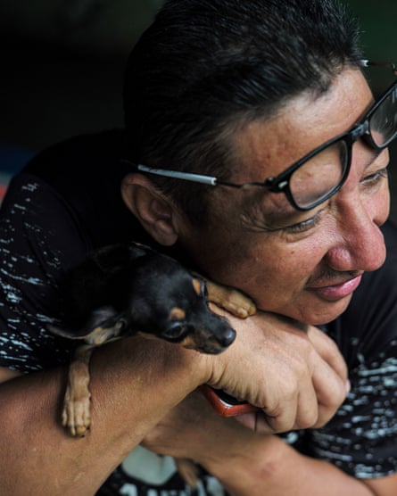 A prisoner carrying his Chihuahua Bestia says that caring for his dog is a full-time job. Tocuyito, Valencia 2022