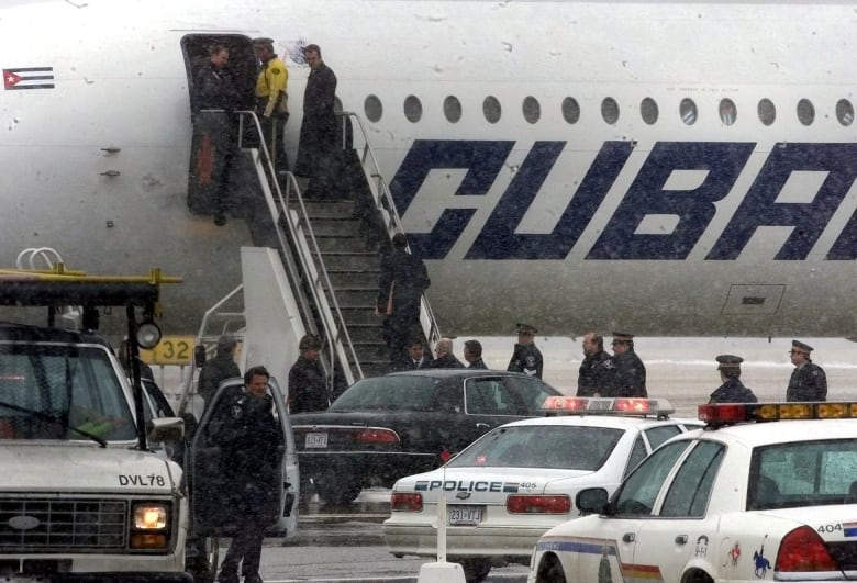 José Imperatori is seen climbing the stairs of a Cuban airliner at Ottawa's international airport on March 2, 2000.