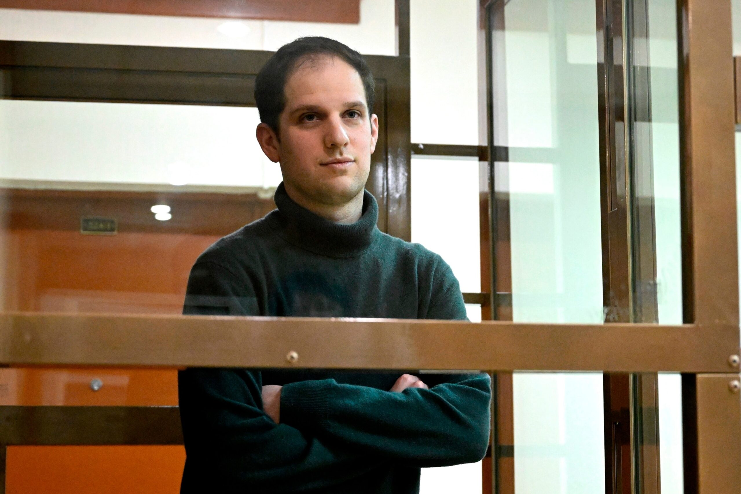 PHOTO: Wall Street Journal reporter Evan Gershkovich stands in a glass cage in a courtroom at the Moscow City Court, in Moscow, Russia, Dec. 14, 2023. 