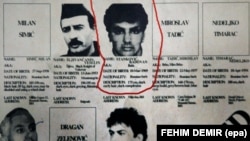 A fugitives list from 2002 with the notice circled for Bosnian Serb Radovan Stankovic, who was being sought by NATO-led international forces for an alleged campaign of mass rapes during the Bosnian War. Stankovic was eventually caught and convicted of crimes against humanity and sentenced to nearly 20 years in prison.