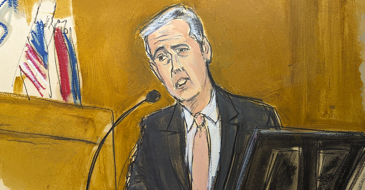 Michael Cohen testifies on the witness stand with a National Enquirer cover story about Donald Trump displayed on a screen in Manhattan criminal court, Monday, May 13, 2024, in New York.