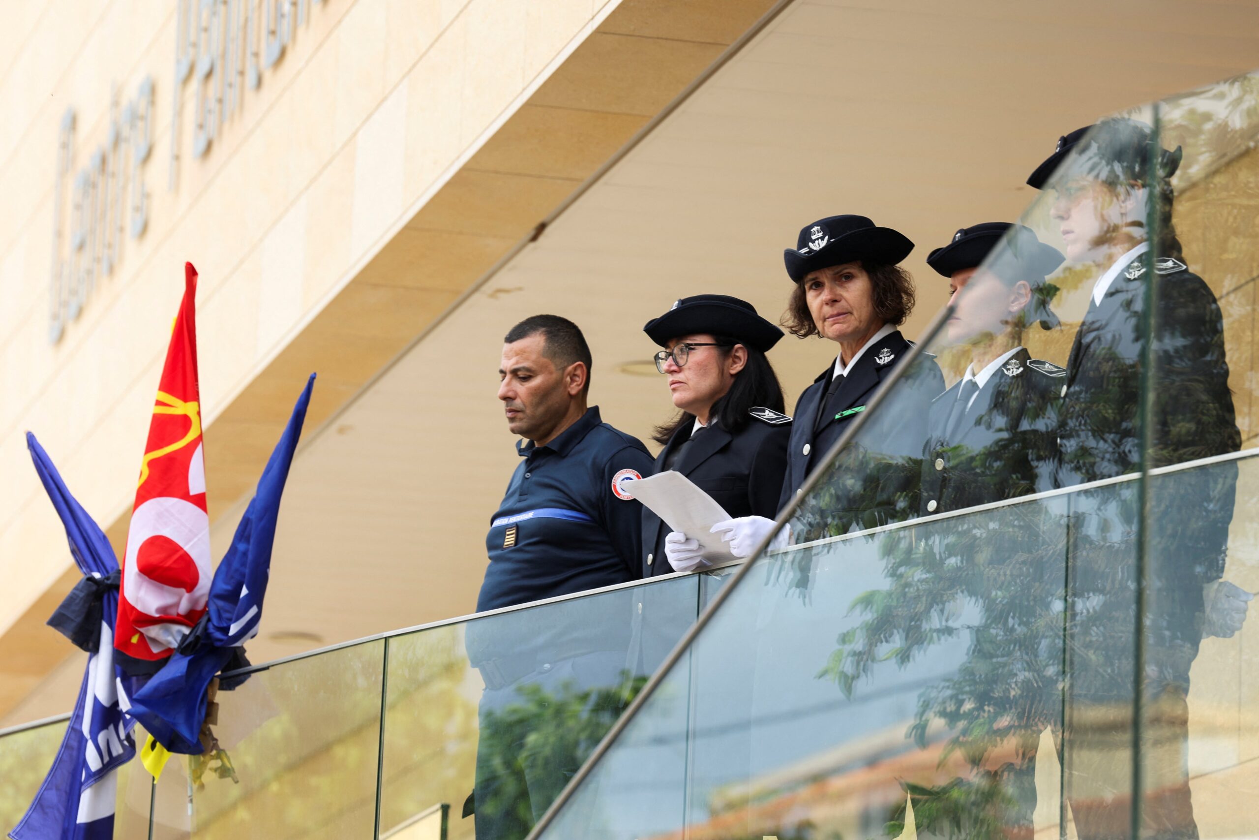 Director of Baumettes Penitentiary Lagier Karine along with members of law enforcement observe a moment of silence on the day of a symbolic one-day shutdown of the country's jails