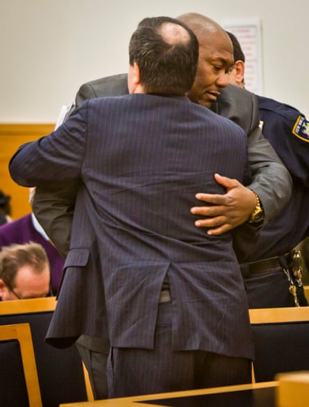 a man hugs his lawyer