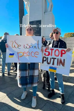 Ksenia was pictured holding a sign with a Ukrainian flag declaring We want peace next to a friend with a Stop Putin poster