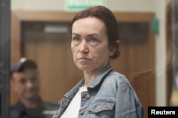 RFE/RL journalist Alsu Kurmasheva, a dual Russian-American citizen, attends a court hearing on May 31 in Kazan, Russia, where she's being held on charges of failing to register as a foreign agent and disseminating fake information about the military.