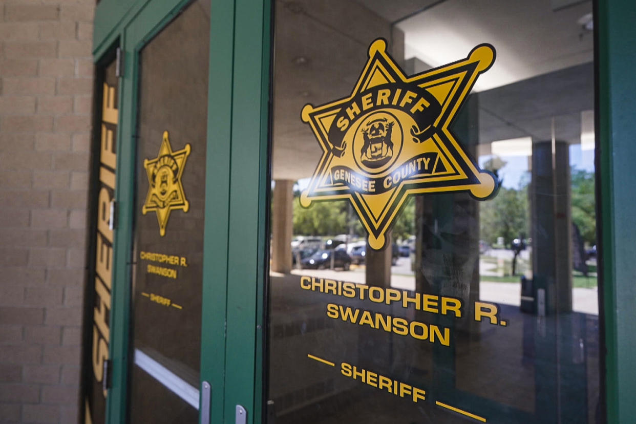 The doors of the The Genesee County Sheriff's Office, a badge and the sheriff's name, Christopher R. Swanson are on the windows (NBC News)