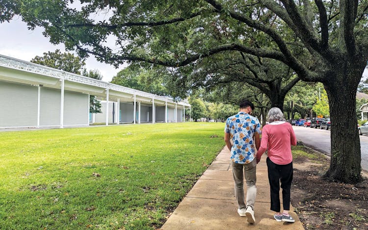 Gabriel Joffe (left) and Jamie Diaz (right) walk outside the Menil Collection in Houston.