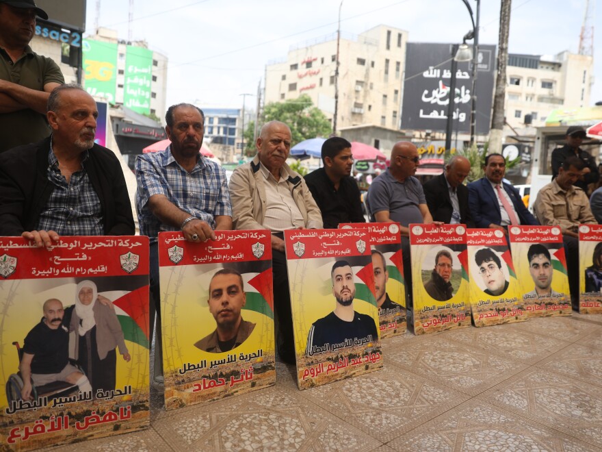 Relatives of Palestinians detained in Israeli prisons demonstrate in front of the Al-Bireh Cultural Center building in Ramallah, West Bank, on May 28.