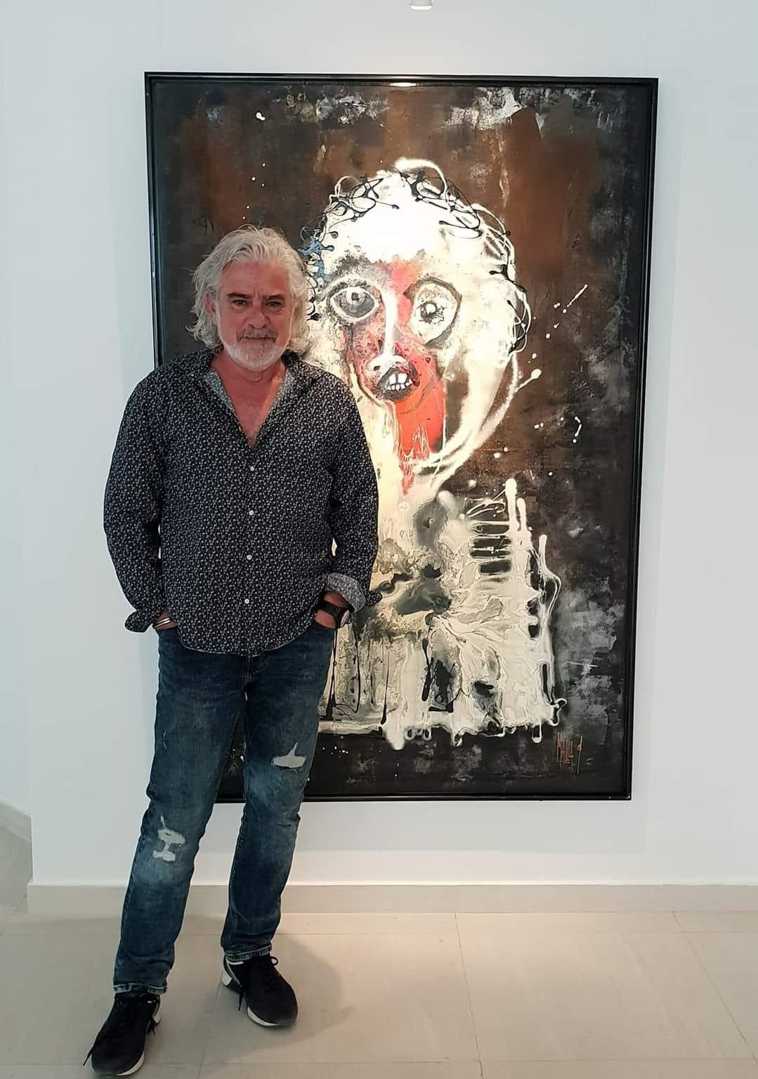 Mark Mallia with one of his paintings. Photo: Facebook