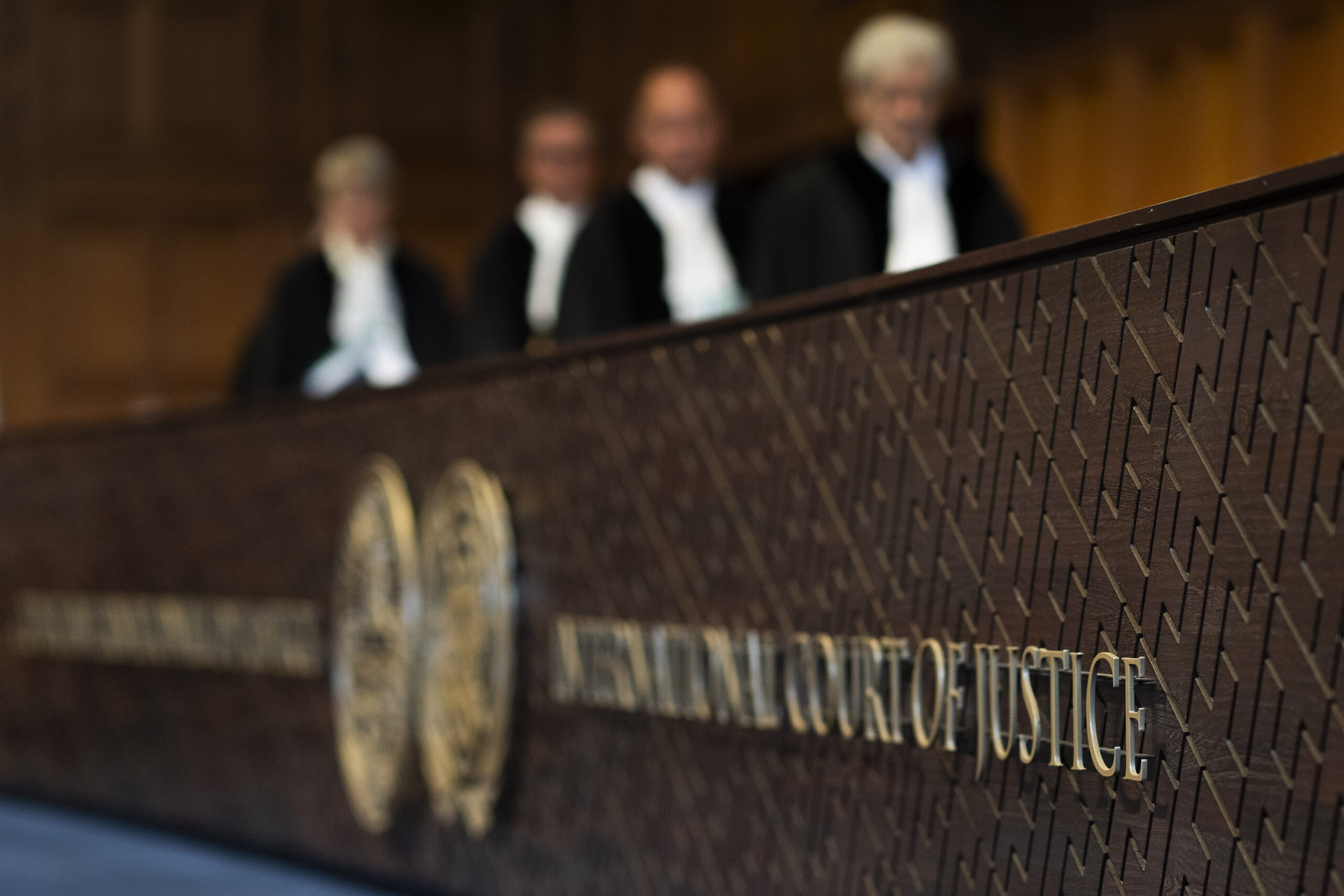 Judges enter the hall of the International Court of Justice