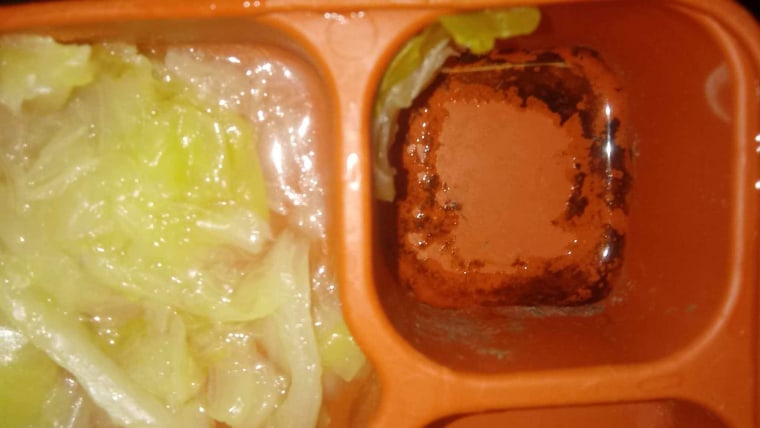 Meals on trays with black mold.