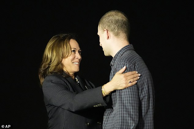 Harris is seen greeting the wrongly incarcerated Wall Street Journal reporter here, just before midnight