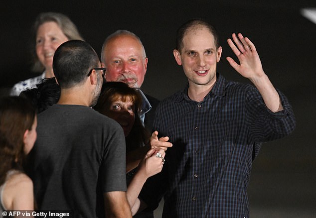 The journalist (seen here) and two other falsely imprisoned Americans landed in the US late Thursday after being freed in a historic prisoner swap. Gershkovich is seen being greeted by relatives and friends here