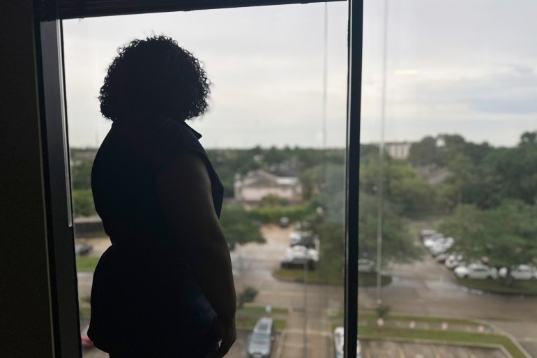 Delisha Boyd in silhouette at a window