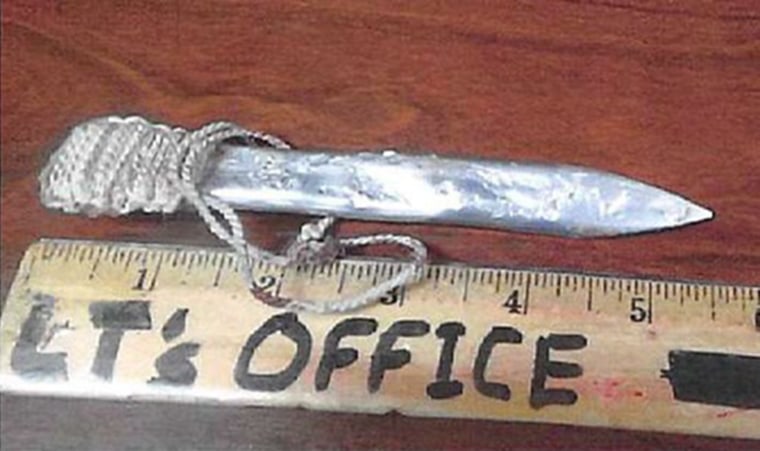 An approximately 5.5-inch flat metal item