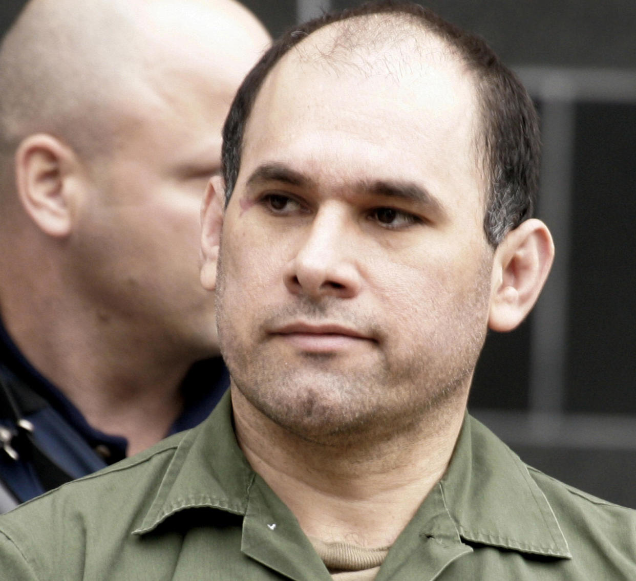 Accused Mexican drug kingpin Osiel Cardenas Guillen, 39, leaves the federal courthouse after pleading not guilty to charges connected to running a cartel, in Houston, Feb. 9, 2007.  / Credit: Pat Sullivan / AP