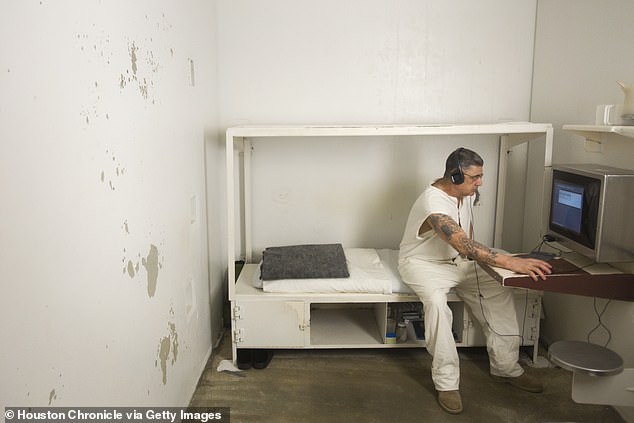 Back in 2007 Texan prisons were similarly overcrowded to Britain's today. Pictured: An inmate works on a computer in his cell at the Estelle Unit in Huntsville, Texas