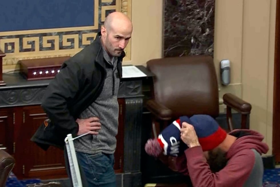 In this image from Senate Television, Leo Christopher Kelly, walks on the floor in the Senate...