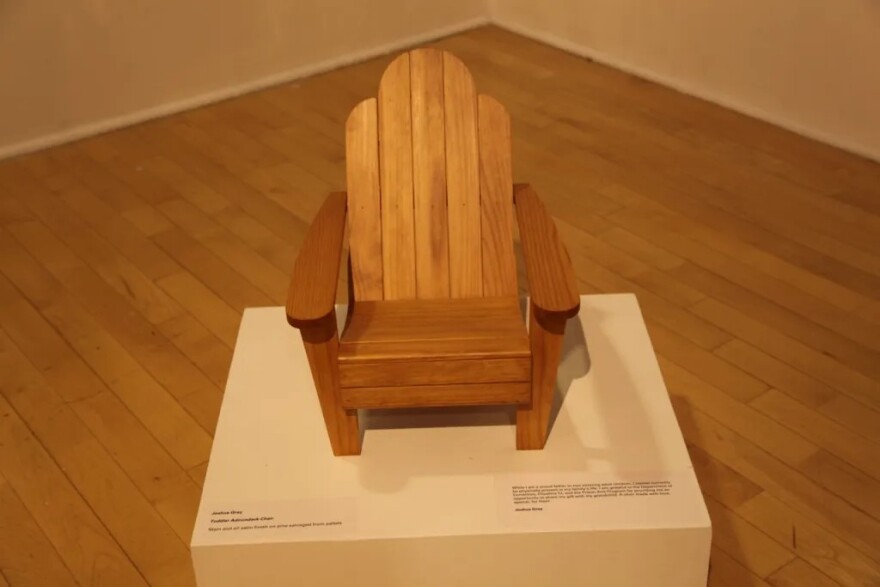 This wooden toddler-sized Adirondack chair was made by Joshua Gray, who called the Prison Arts Program a way to share his gift with the grandchild he cannot be with.