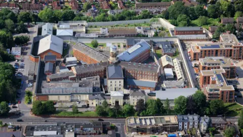 Getty Images An aerial photo of the prison. It's a square complex with buildings arranged in a star shape around a central tower.