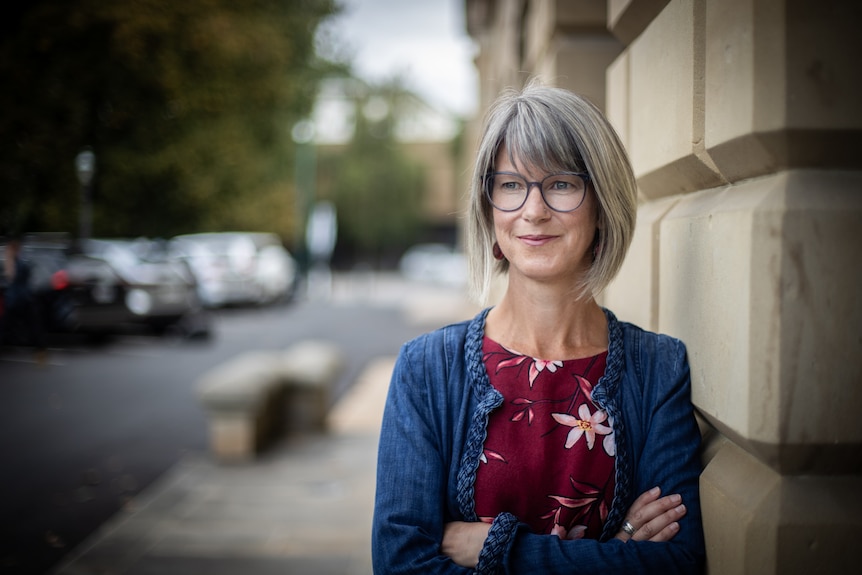 A woman standing in front of parliament house in Hobart.