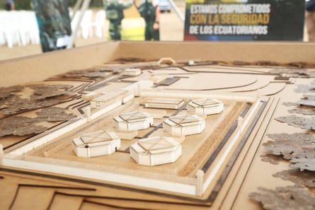 A model showing five square buildings and a rectangular block surrounded by a perimeter wall