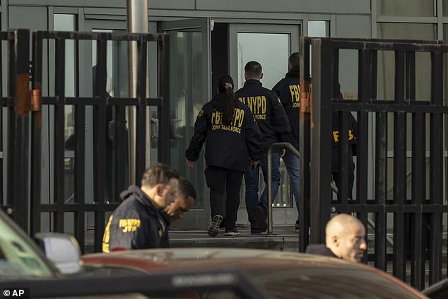 Federal enforcement officers are seen entering the detention during the operation Monday morning