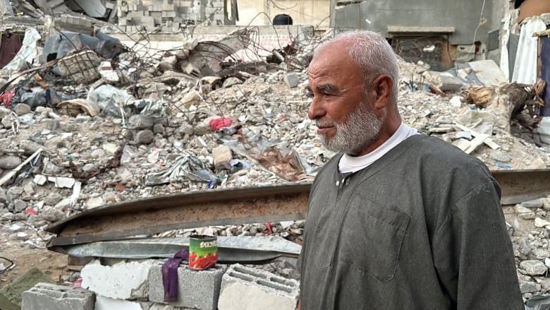 A man walks amid rubble in Gaza.