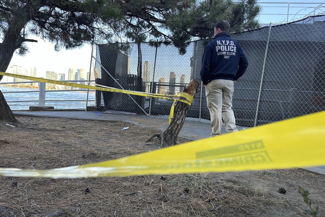 An NYPD officer at the scene of one of Monday's stabbings in New York.