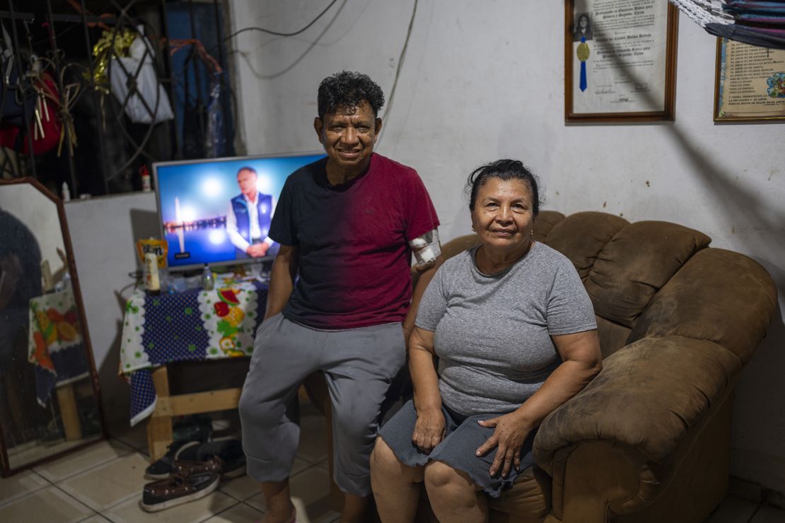 Salvador Molinas, pictured with his mother, welcomes the crackdown. He says his family feels safer.