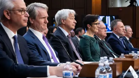 Getty Images Big bank executives including, from left, Wells Fargo chief Charles Scharf,  Bank of America boss Brian Moynihan, JPMorgan Chase chairman Jamie Dimon and Citigroup chief Jane Fraser at a hearing in Congress pushing for lighter regulatory requirements