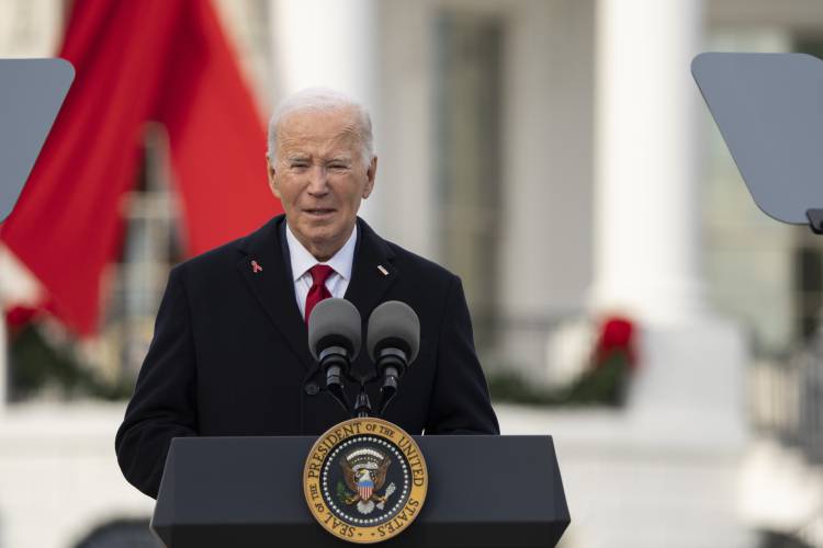 President Joe Biden speaks on the South Lawn of the White House during a ceremony to commemorate World AIDS Day with survivors, their families and advocates, Sunday, Dec. 1, 2024, in Washington. (AP Photo/Manuel Balce Ceneta)