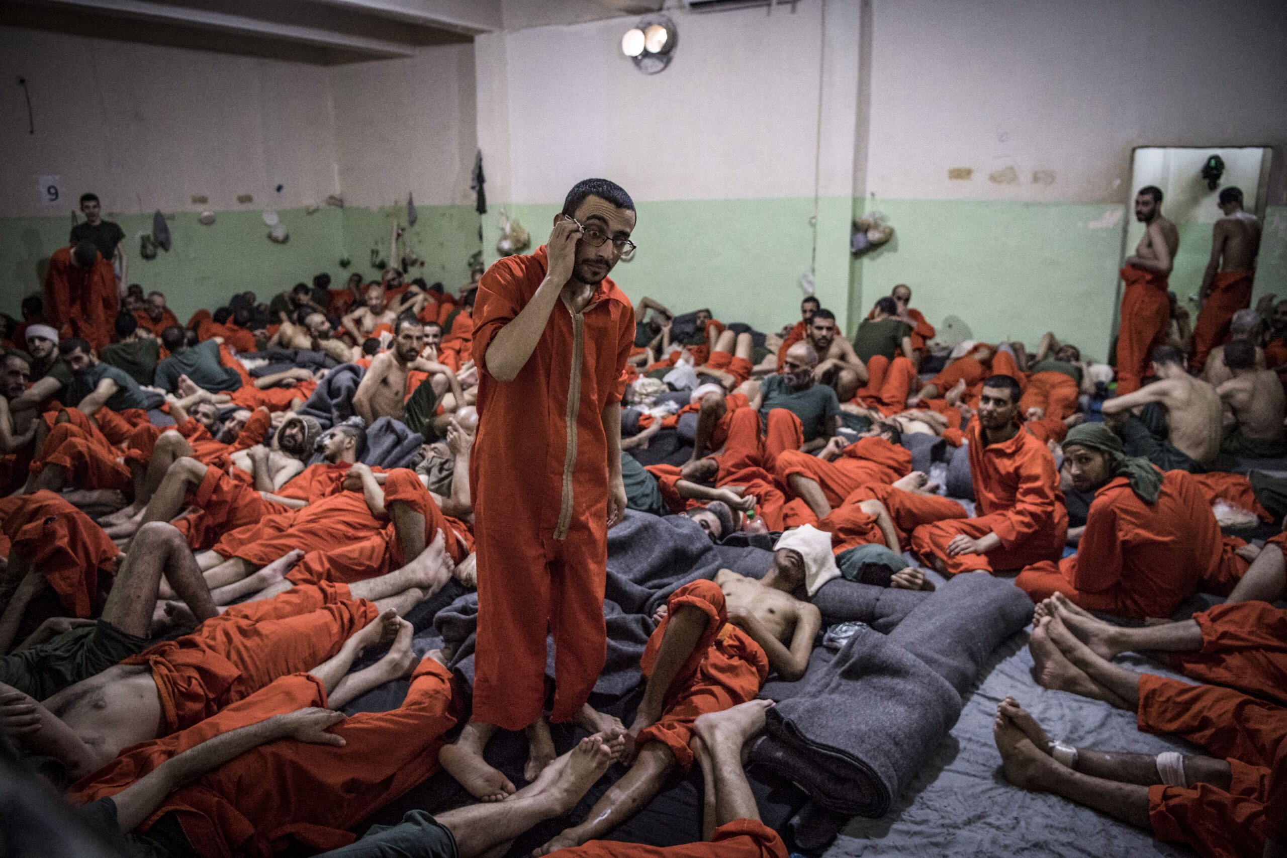 Suspected Islamic State prisoners in a Syrian prison cell.