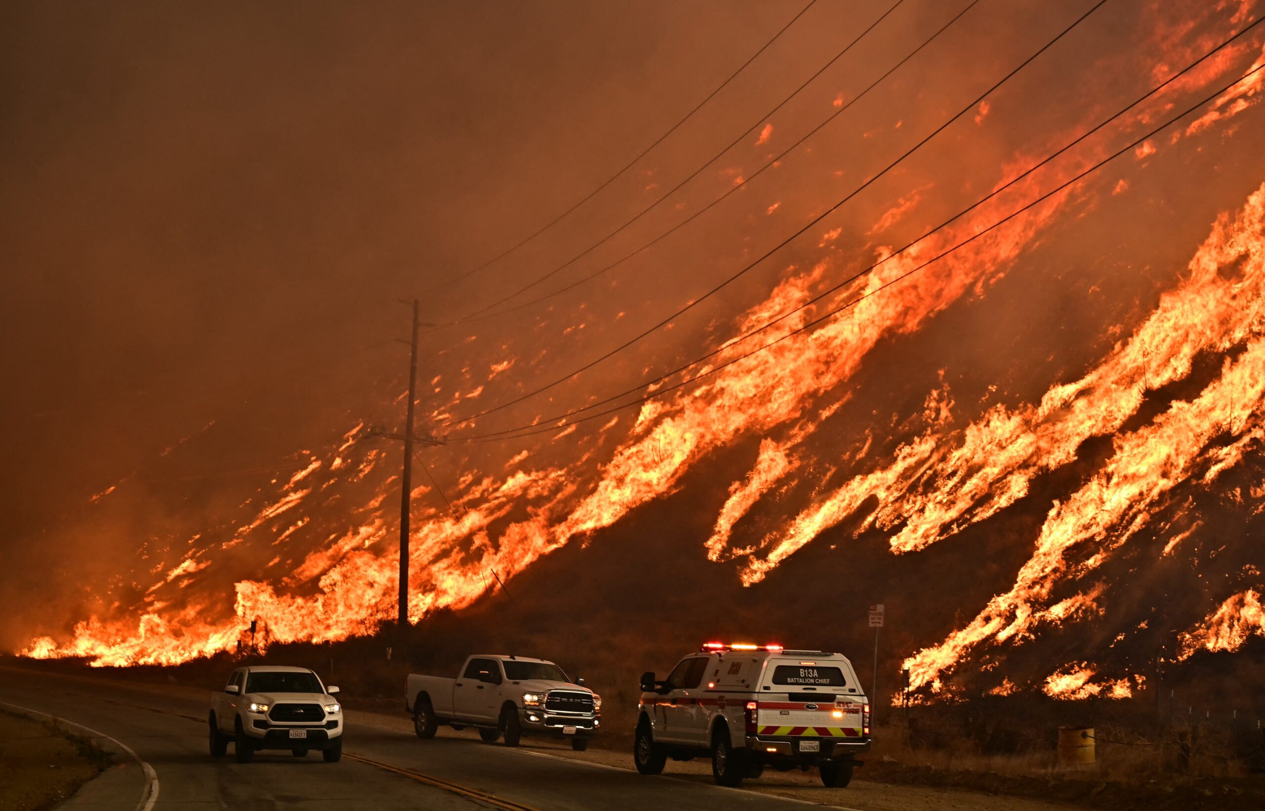 Emergency vehicles near a wildfire.