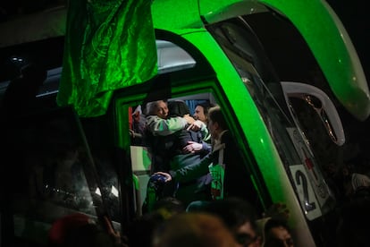 A Palestinian prisoner is greeted before she disembarks from a bus after being released from an Israeli prison, in the West Bank city of Beitunia, early Monday, Jan. 20, 2025. 