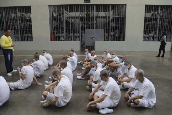 Inmates attend class on social behavior during a press tour of the Terrorism Confinement Center, or CECOT, in Tecololuca, El Salvador, Thursday, Oct. 12, 2023. Inmates wear masks as a precaution to not spread COVID-19. (AP Photo/Salvador Melendez, File)