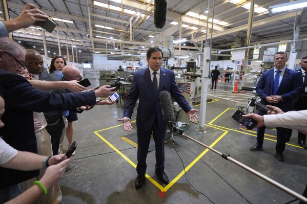 U.S. Secretary of State Marco Rubio speaks to the media during a visit to the aircraft maintenance firm Aeroman in San Luis Talpa, El Salvador, Monday, Feb. 3, 2025. (AP Photo/Mark Schiefelbein, Pool)