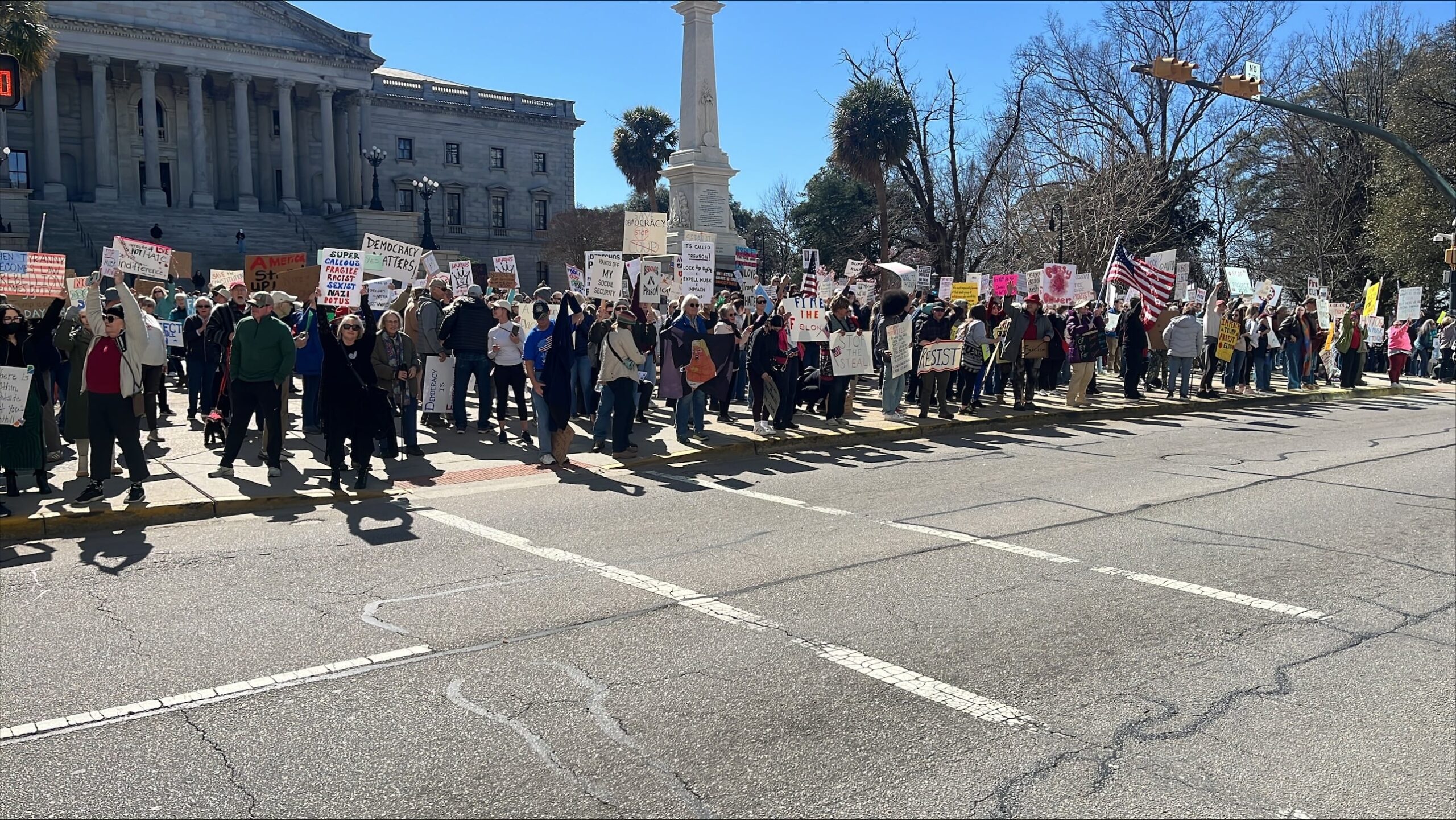 Crowds rally outside State House on Presidents Day