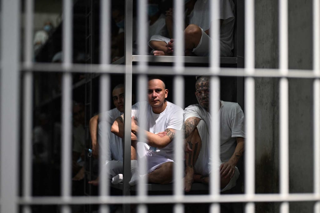 Inmates look out from a cell at the CECOT mega-prison in El Salvador last month. Photo: AFP