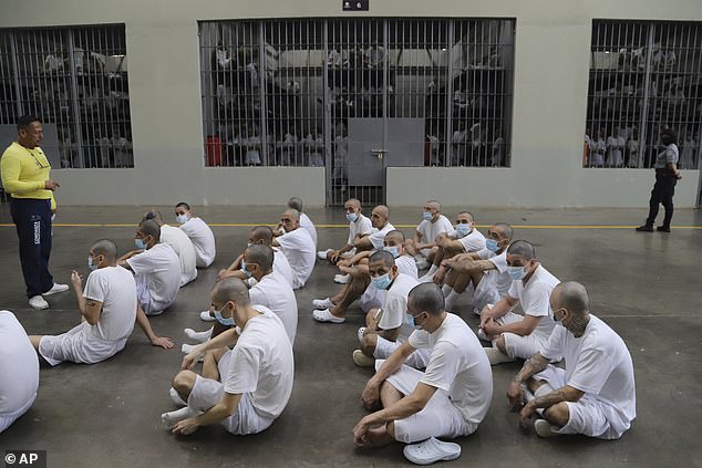 Inmates attend class on social behavior during a press tour of the Terrorism Confinement Center, or CECOT, in Tecololuca, El Salvador, Thursday, Oct. 12, 2023