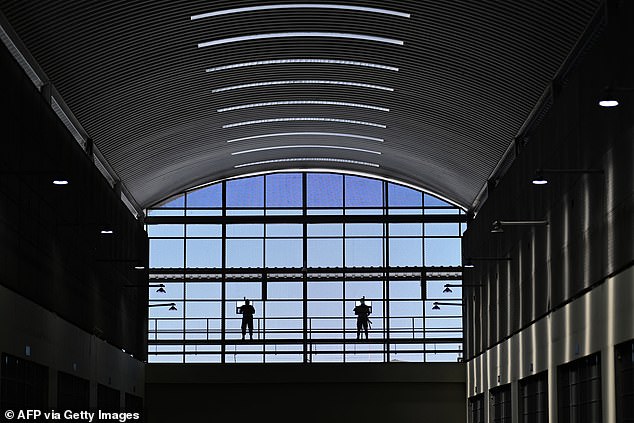 Prison officials stand guard on a pavilion inside the Counter-Terrorism Confinement Centre