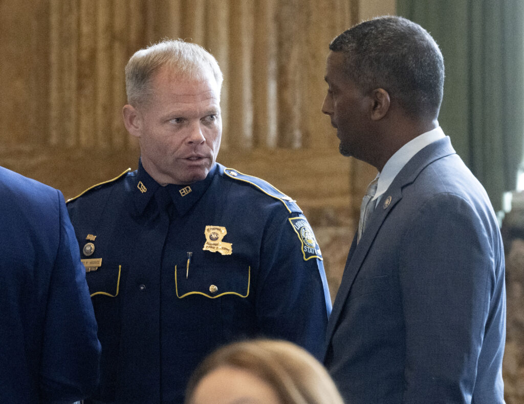 Louisiana State Police Superintendent Col. Robert Hodges, left, speaks with Rep. Edmond Jordan, D-Baton Rouge, on opening day of the regular legislative session, Monday, March 11, 2024, at the Louisiana State Capitol in Baton Rouge.