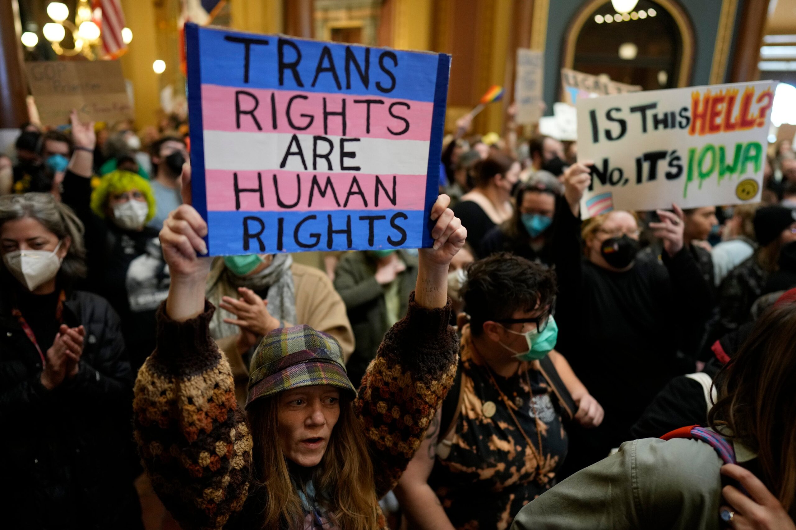 Protesters fill the Iowa state Capitol in Des Moines last month to denounce a bill that would strip the state civil rights code of protections based on gender identity