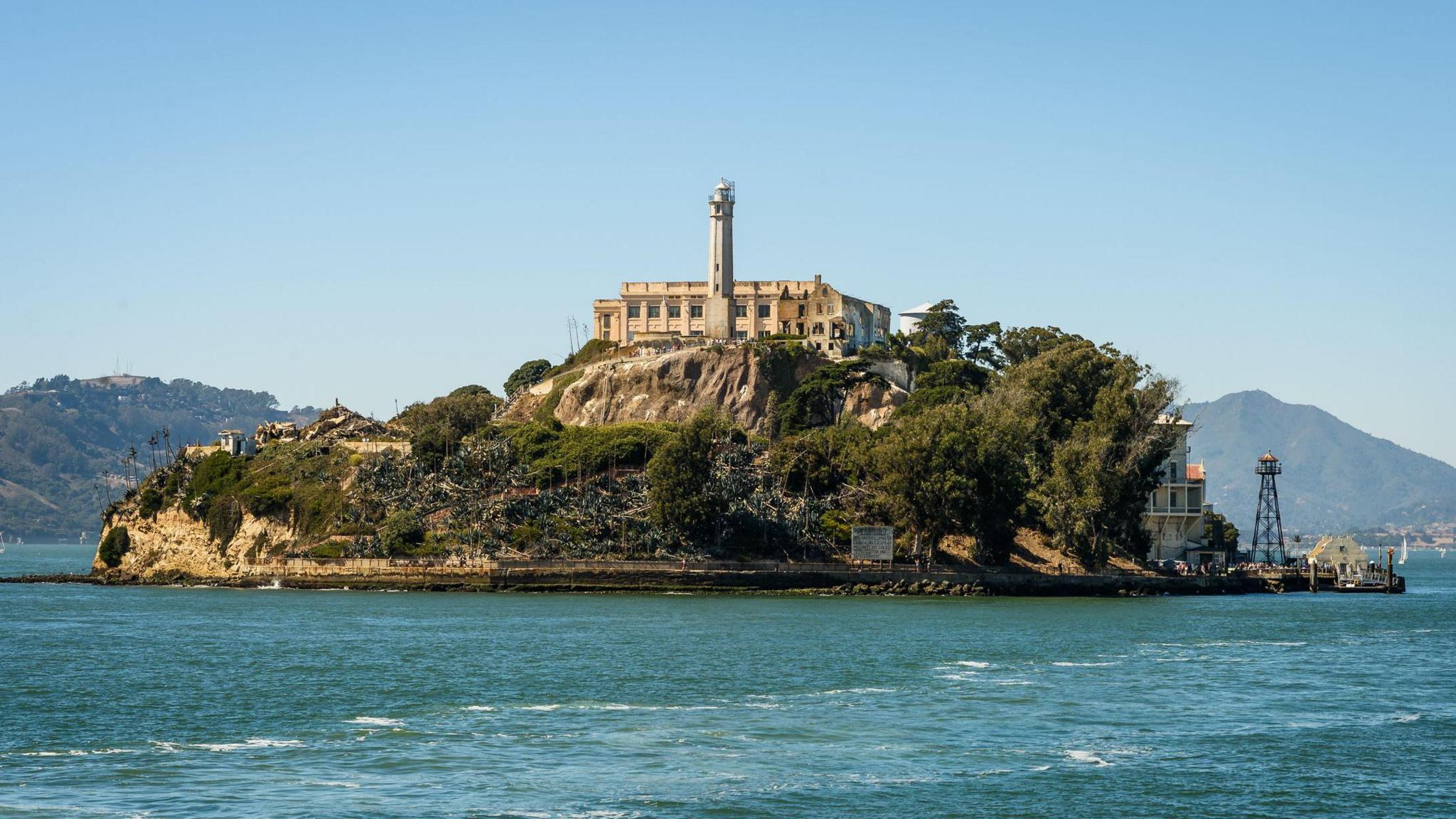 An island with a disused prison on it, surrounded by blue sea