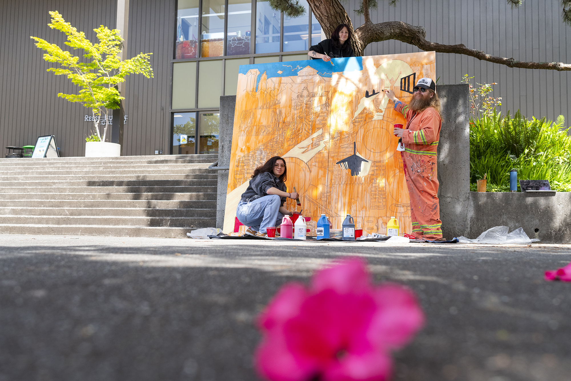 students painting a mural