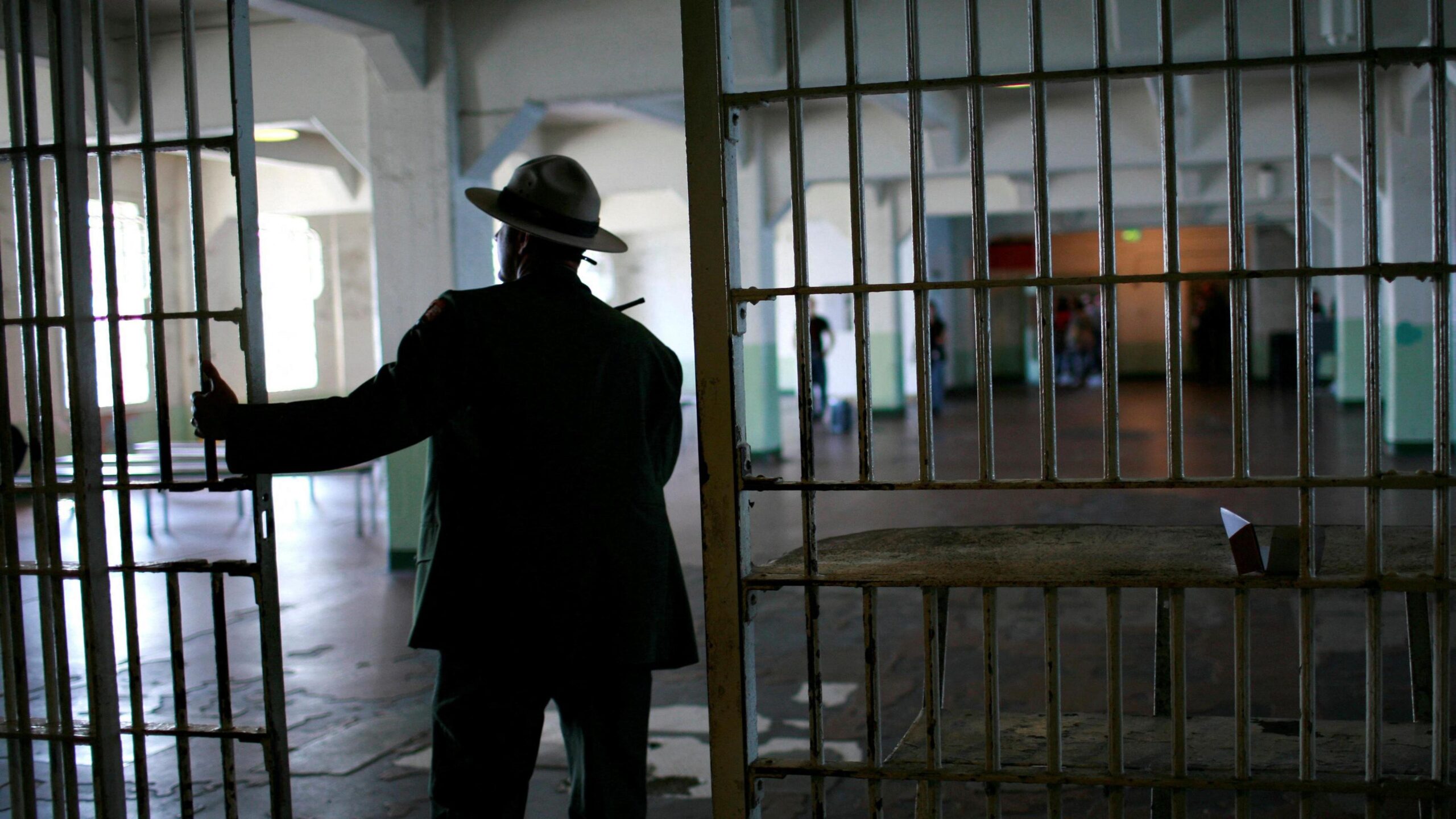 A U.S. National Park Service ranger walks from the kitchen to the dining area at Alcatraz Island