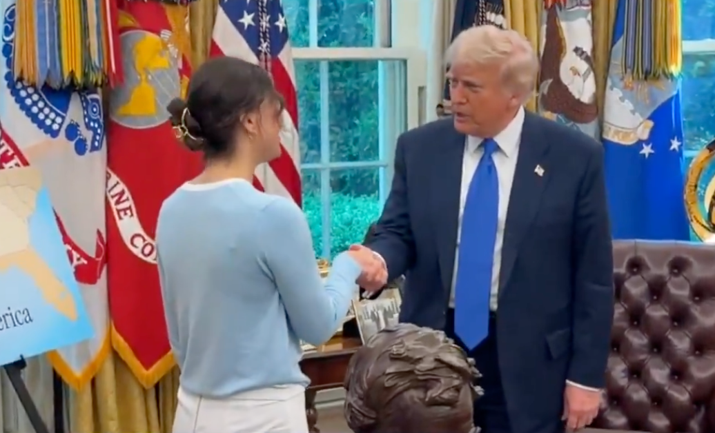 President Donald Trump shakes Ksenia Karelina's hand in the Oval Office