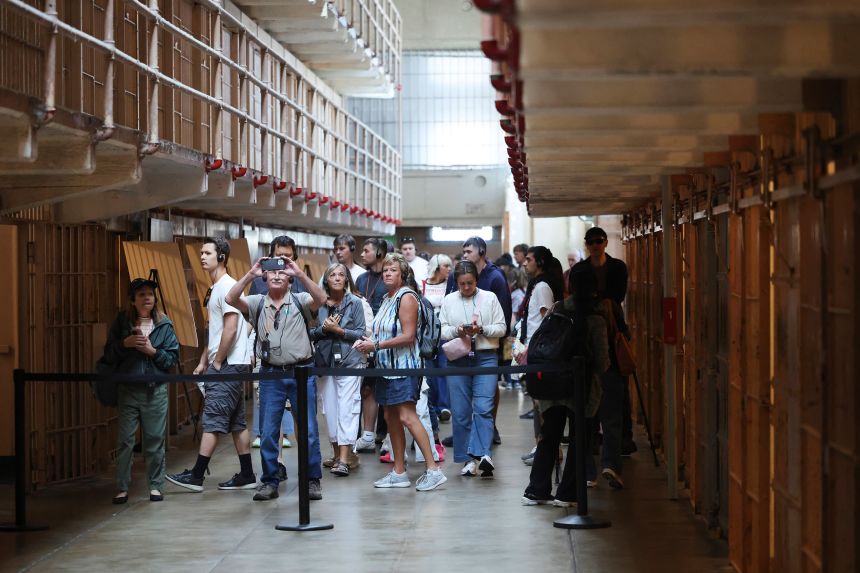 Visitors this month tour the prison cells on Alcatraz Island.