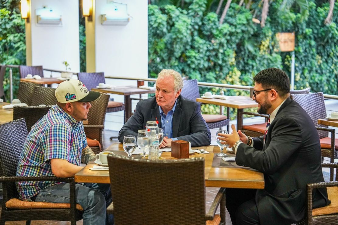 An image posted on X by El Salvador's president Nayib Bukele shows US Sen. Chris Van Hollen meeting with Kilmar Armando Abrego Garcia, the Maryland man mistakenly deported from the United States. Sen. Van Hollen said the salt rimmed glasses were placed on the table by Bukele's staff and were not touched by Van Hollen, nor Abrego Garcia.